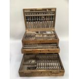 A Mappin & Webb oak two drawer canteen of silver plated cutlery or twelve place settings, 26cm