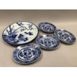 A large late 19th century Chinese charger painted with prunus and pheasant together with four oval