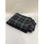 Quantity of tartan fabric in green, mauve and red