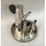 Mid 20th. Century stainless steel condiment set comprising salt & pepper, dressing jug, in tray with