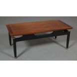 A G-Plan mahogany and black coffee table, rectangular, on black frame with tapered legs and gilt
