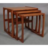 A nest of three G-Plan teak occasional tables, c1970, on open rectangular standards, 53.35cm wide