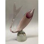 Murano, Italy, A magenta and pale coral tinted glass sculpture of a fish, raised on a glass dome