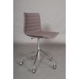 Arper, Italy, A chrome swivel desk chair with fabric back and seat, on five legs with casotrs.