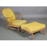 An Ercol beech no 203 armchair and matching footstool with yellow fabric cushions. PLEASE NOTE The
