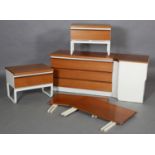 A set of teak and cream finished bedroom furniture c late 1960s/70s, including a pair of bedside