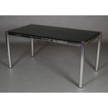 A 1970s black ash and chrome dining table, rectangular, with cut away corners and inset