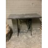 A Singer sewing machine base converted to a table