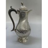 A Victorian silver hot water jug London 1881 for Charles Stuart Harris, wrythern baluster form