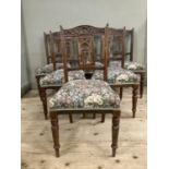 A set of six Edwardian walnut dining chairs