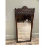 20th century oak wall mirror with carved crest, 96cm high
