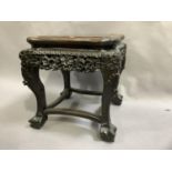 19th century Chinese hardwood urn stand having a later inset mahogany surface, carved apron on