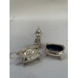 An Elizabeth II silver three piece condiment set, Birmingham 1960, the salt, pepper and mustard