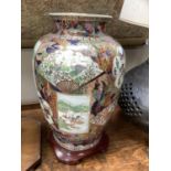 Large Chinese baluster vase painted with cartouches containing figural scenes and landscapes edged