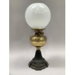 Oil lamp style metal stepped base, brass reservoir and opaque orb shade, 48cm high