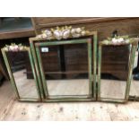 Gilt triptych mirror with two fold out panels, moulded with polychrome flowers, 53cm x 80cm