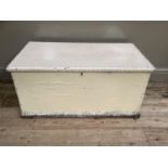 A white painted wooden lodging box with studded detailing and twin handles