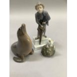 Royal Copenhagen figure of a sea lion, mouse on a conker, and boy with umberella on plinth base A/F