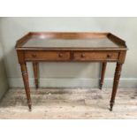 Victorian mahogany washstand with raised back above two drawers on turned legs with brass castors,