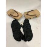 A pair of Japanese wooden shoes and pair of black tabi socks