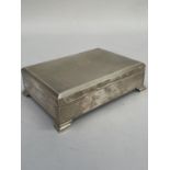 A Queen Elizabeth II silver cigarette box of rectangular outline, initialled, engine turned