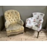 A small tub chair upholstered in white floral decorated fabric with scumbled cabriole legs