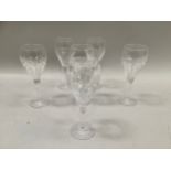 A suite of six Stuart cut wine glasses with ridged and indented design, 20cm high