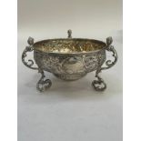 A George V silver bowl London 1911 by D and D Welby Ltd, foliate chased with open cartouche, on