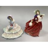 Two Royal Doulton figures of ladies, 'Day Dreams' and Autumn breeze'