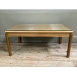 A mid century beech topped coffee table with glass top, 90cm wide