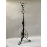 Cast metal and brass telescopic light stand with ornate foliate tripod base