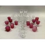 Quantity of cranberry custard cups and glasses, six etched 19th century glasses on knopped stems