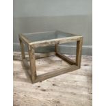 A washed oak and glass inset coffee table