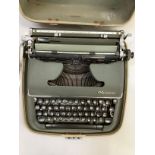 Olympia De Luxe portable typewriter in carry case