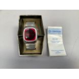 A gentleman's Commodore electronic quartz wristwatch with ruby red glass and digital display,