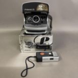 A Polaroid 600 instant camera, boxed, along with an Agfa Mini 110 format camera. Untested.