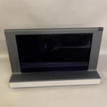 A Bang and Olufsen Beovision 8-26 26” TV with remote control and instructions. Untested.