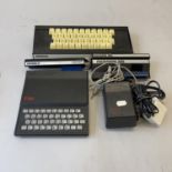 A Sinclair ZX81 home computer, complete with Memopak Keyboard, Memopak memory expansion modules