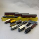 A collection of Tri-ang TT Gauge carriages and rolling stock, including two T82 Mainline Composite