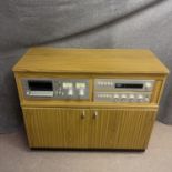 A vintage 1970s hifi system in a custom built cabinet