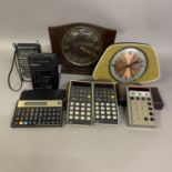 A collection of early LED calculators, including two Hewlett Packard 22 finance calculators with