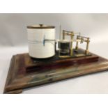 A Negretti and Zambra oak cased barograph, 20th century serial no. R/39620, 38cm high