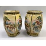 A pair of vintage printed tins of hexagonal form printed with rural and village scenes to each