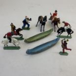A collection of Britains military figures, including a Native American Indian, two canoes and