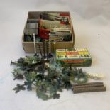A collection of 00 Gauge trackside accessories, including trees, fences, telegraph poles, signal