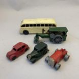A collection of four Triang Minic clockwork vehicles, including two saloon cars, a tractor (