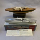 A model speedboat ‘Miss England’ with a methylated spirits engine, boxed, along with an Ailsa Pond