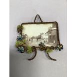 A Victorian cold painted gilt wire miniature photograph frame with hanging loop. 6.5cm x 7cm
