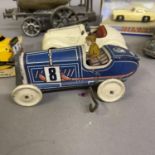 A collection of tin plate clockwork cars and others, including a Gutmann of Paris Memo 708 racing