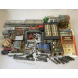 An extensive collection of 00 gauge plastic, card and cast-metal trackside buildings and